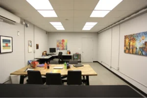 Photo of a PNNL light perception testing laboratory illuminated by Telelumen Dittosizer programmable LED luminaires. The photo shows the light quality to be programmed to “warm” appearance, red spectrum enhanced, CCT values less than 4000K.